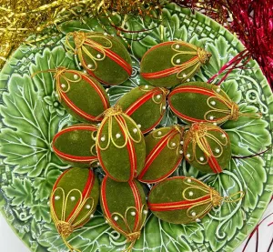 Fun and rare vintage 1970s green velvet covered egg style ornaments with gold ribbed trim and pearl accents.
